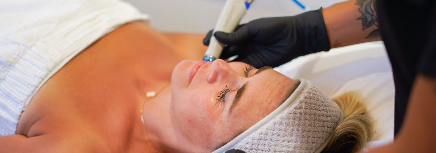 Woman getting hydrafacial treatment